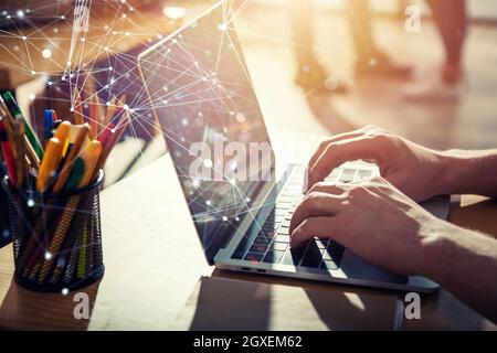 Business man works in office with laptop. Concept of internet network and sharing Stock Photo
