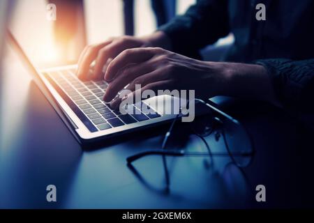 Business man works in office with laptop. Concept of internet network and sharing Stock Photo