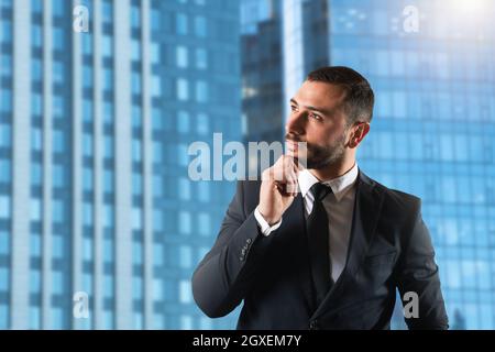 Businessman thinks new business strategies to grow up the company Stock Photo