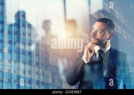Businessman thinks new business strategies to grow up the company.double exposure Stock Photo