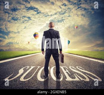 Man walks on a big success way. Concept of successful businessman and company startup Stock Photo