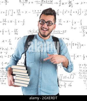 Nerd boy studying in classroom for math Stock Photo