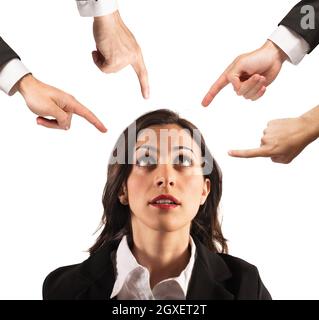 Businesswoman blamed unfairly by her work colleagues Stock Photo