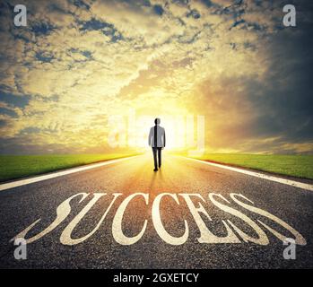 Man walks on a big success way. Concept of successful businessman and company startup Stock Photo