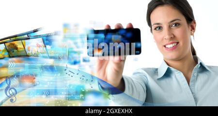 Businesswoman sharing music and video Stock Photo