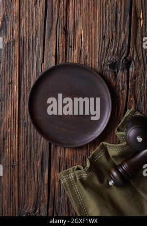 Empty plate on wooden table Stock Photo