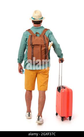 Man from behind with suitcase and backpack Stock Photo