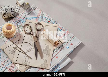 Accessories for sewing - fabric, pins, thread, buttons, top view Stock Photo