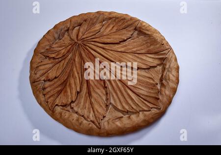 Wooden tray with maple leaf picture on white isolated background Stock Photo