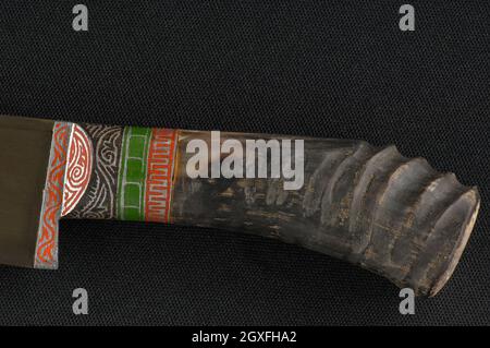 Decorative oriental knife on the black background. Bone handle Stock Photo