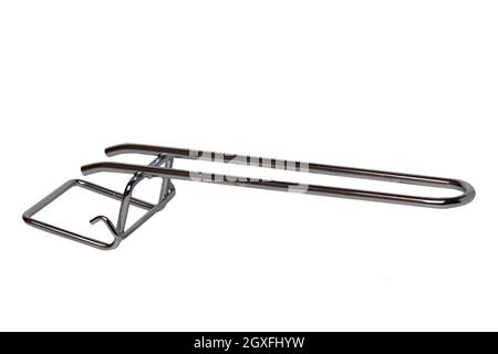 Metal handle for removing the baking tray or grill rack from the oven isolated on a white background. Macro. Stock Photo