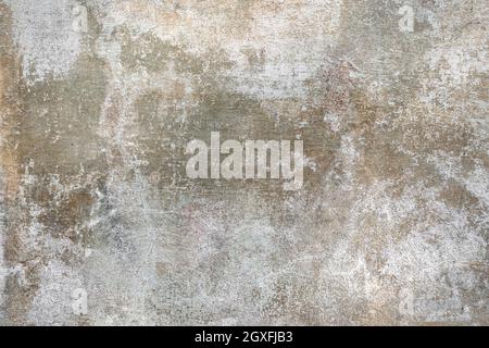 White green red old wall with damaged plaster. Old shabby wall with peeling plaster. Stock Photo