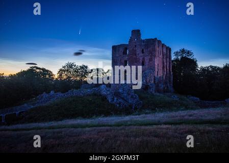 Norham Castle in the early hours of July 2020 with Comet Neowise Stock Photo