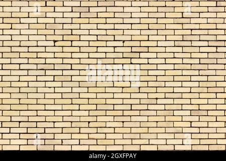 A light yellow sand colour brick wall from a distance. Stock Photo