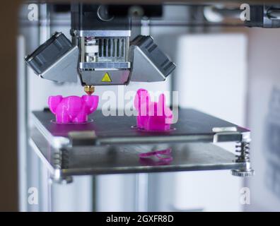 Automatic 3d printer performs a three-dimensional product creation, close-up Stock Photo