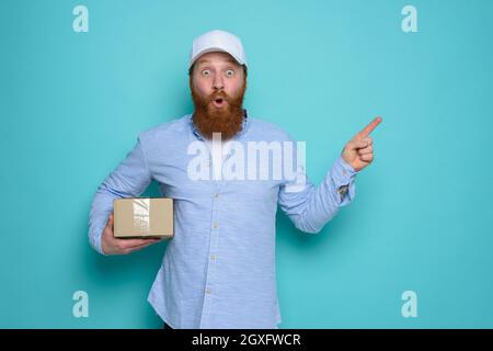 Courier with wondered expression about a great promotion Stock Photo