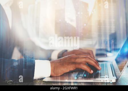 Businessman works with laptop and Futuristic lights on screen. Global internet connection and streaming concept Stock Photo