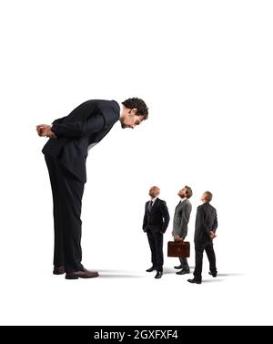 Big businessman looking small businessmen. Severe boss humiliates his employees Stock Photo