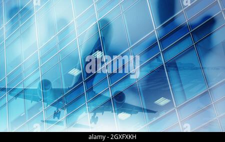 Take off of a modern aircraft with double exposure of airport Stock Photo