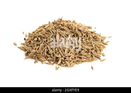 Pile of Cumin seeds isolated on white background. Cuminum cyminum Stock Photo