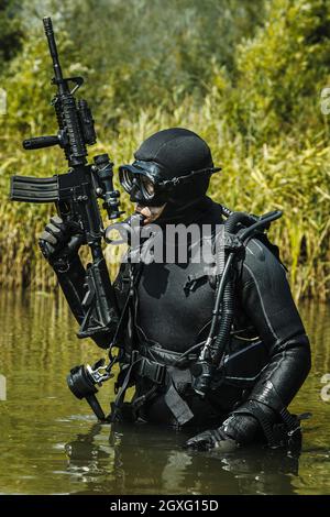 Frogman with complete diving gear and weapons in the water Stock Photo
