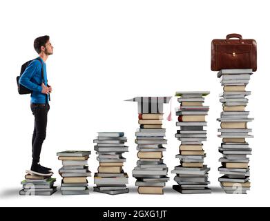Boy climbing the stairs made of books Stock Photo