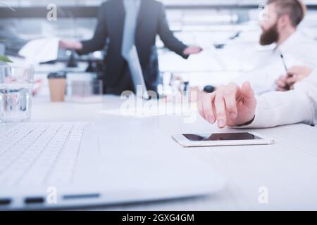 Businesswoman works on a mobile phone. in office. Concept of internet sharing and interconnection Stock Photo