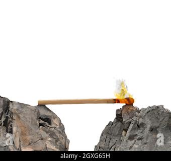 Match lit between two mountains. Instability and Fear of obstacles to overcome Stock Photo