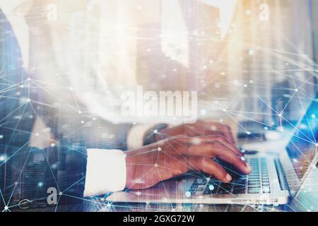 Businessman works with laptop and Futuristic lights on screen. Global internet connection and streaming concept Stock Photo