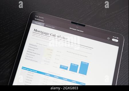 New york, USA - October 5 2021: Mortgage calculator spreadsheet charts on tablet screen close up view Stock Photo
