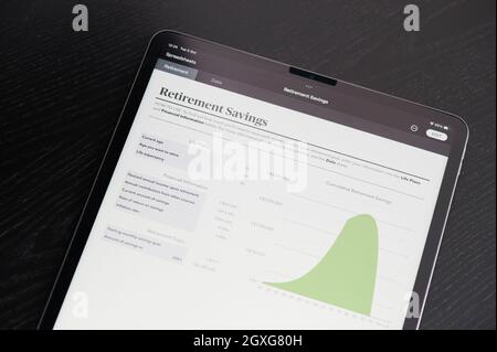 New york, USA - October 5 2021: Retirement savings spreadsheet charts on tablet screen close up view Stock Photo