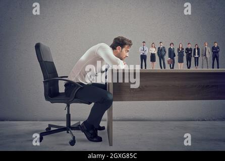 Boss selects suitable candidates to the workplace. Concept of recruitment and work team Stock Photo