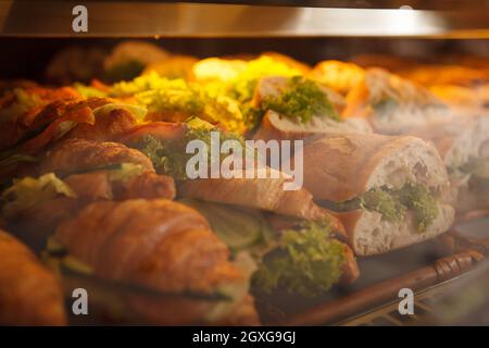 Close up of delicious fresh croissants on retail display at bakery store Stock Photo