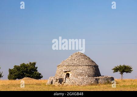 Trulli, typical houses near Castel del Monte, Apulia region, Italy Stock Photo