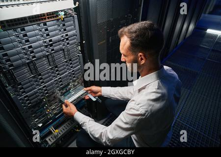 Professional it specialist working in data center Stock Photo