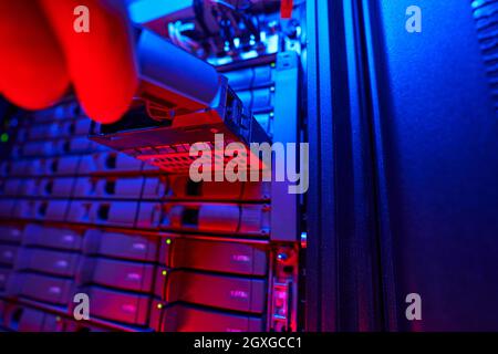 Modern tech equipments on server racks in server room Stock Photo