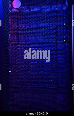 Close up image of dark server room with a lot of hard drives in data center Stock Photo