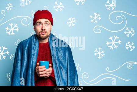 Boy caught a cold and drinks the. Cyan background. Concept of illness Stock Photo