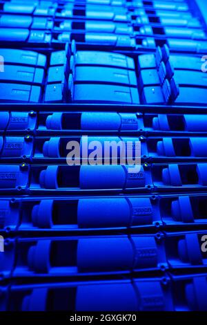 Close up front view picture of working HDD disks on server racks in data center Stock Photo