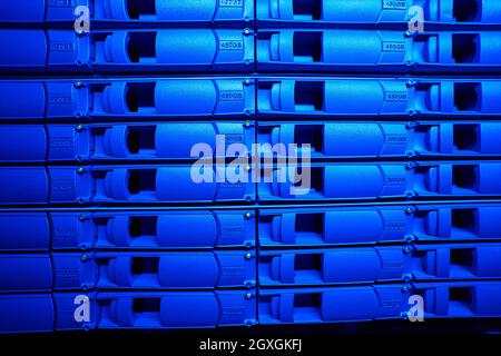 Close up front view image of modern hard drives on server racks Stock Photo