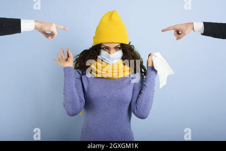 Girl caught a cold and someone give her a mask. Stock Photo