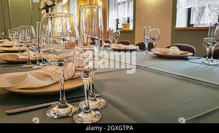 Festive table setting in the restaurant. Wedding preparations. Selective focus. Copy space. Stock Photo