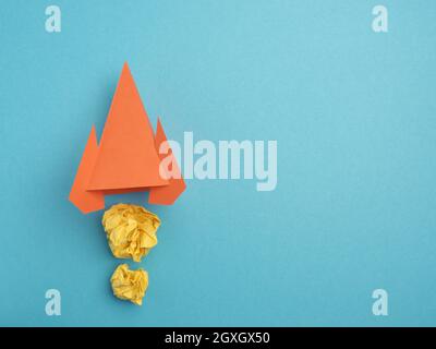 Launching paper rocket with jet stream of paper balls, creativity concept or new ideas metaphor, start up business , new year’s resolution Stock Photo