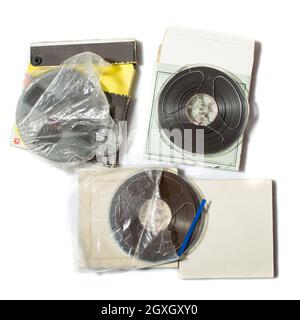 Retro reel to reel tapes on a carton box on white background Stock Photo