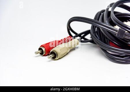 Two red and white audio RCA plugs isolated on a white background. Analog technology. Commonly used to carry audio and video signals Stock Photo