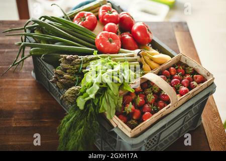 Fruits and vegetables delivery box on the dining table Stock Photo
