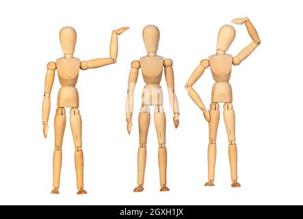 Many wooden mannequin doing differents gestures isolated on a white background Stock Photo