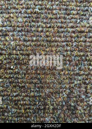 Wool texture. Background from gray wool. Fleecy background. Background of fleecy carpet. Texture of gray-brown carpet. Fleecy surface. Close up of tex Stock Photo