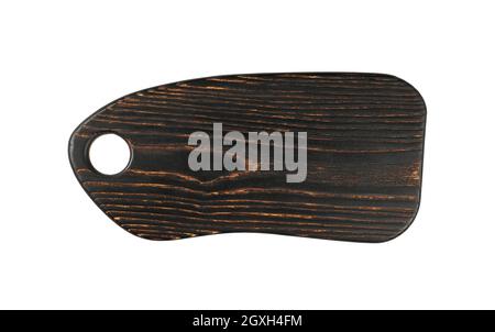 Close up of one shaped dark burnt oak wood kitchen cutting board isolated on white background Stock Photo