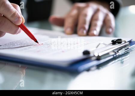 Editing Essay Content On Paper. Proofreader Marking Mistake Stock Photo